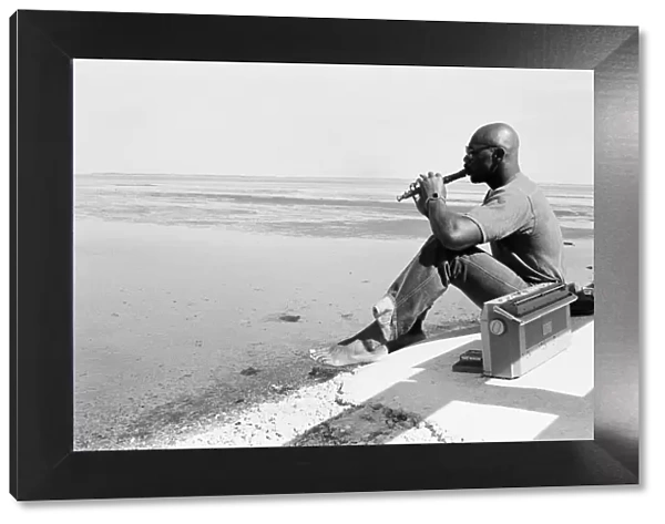American boxer Marvin Hagler relaxes with a flute ahead of his title challenge against