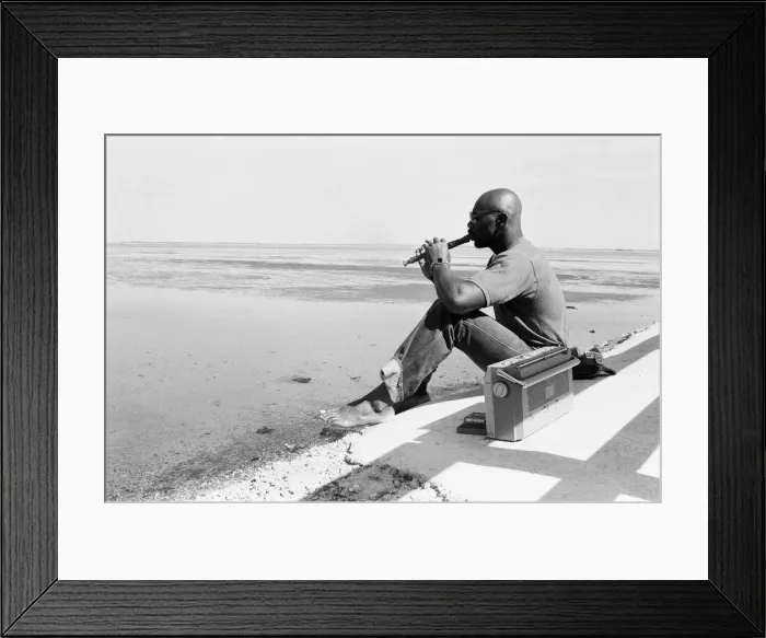 Framed Print : American boxer Marvin Hagler relaxes with a flute ahead of his title challenge against Framed Print : American boxer Marvin Hagler relaxes with a flute ahead of his title challenge against