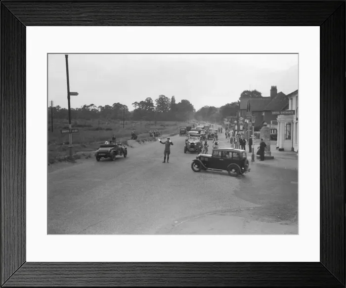 Framed Print : A a patrolman directs August Bank Holiday traffic outside The Orleans Arms situated