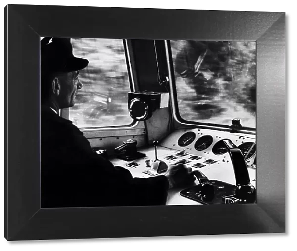 Train driver Charles Dutton in the cab of the electric express locomotive train The