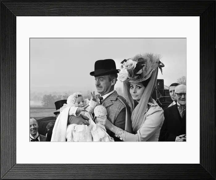 Framed Print : Sophia Loren and David Niven filming Lady L'with baby Simon, aged 9 months