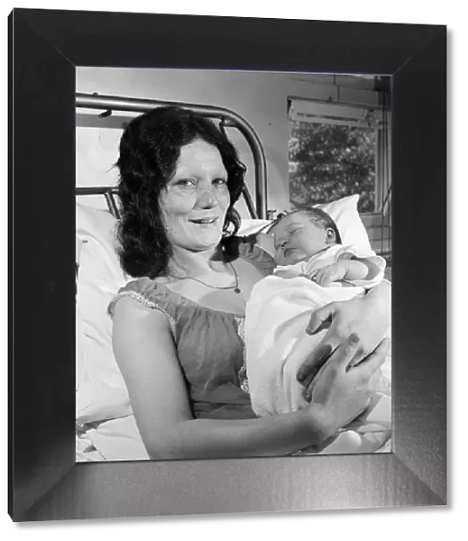 A mother holding a baby at Carter Bequest hospital. Circa 1973
