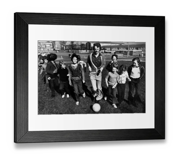 Framed Print : Liverpool footballer David Fairclough finds time for a kick about with some of