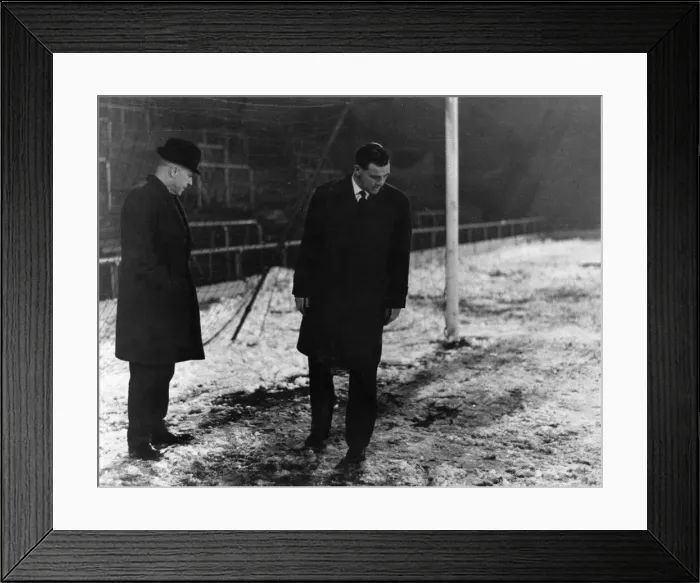 Framed Print : Liverpool manager Bill Shankly inspecting the snow covered pitch before a match Framed Print : Liverpool manager Bill Shankly inspecting the snow covered pitch before a match