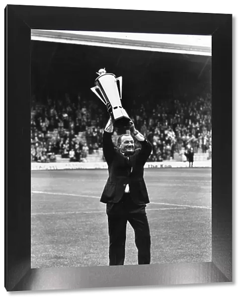 Liverpool manager Bob paisley holds aloft his Manager of the Year Award before the match