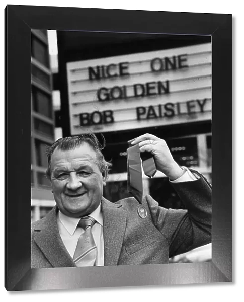Liverpool manager Bob Paisley proudly displays his latest award as '