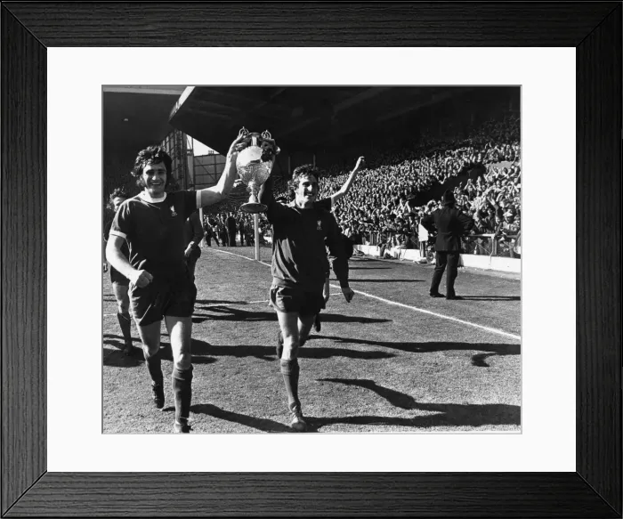 Framed Print : Ray Clemence and Larry Lloyd of Liverpool parade the League Championship trophy following Framed Print : Ray Clemence and Larry Lloyd of Liverpool parade the League Championship trophy following