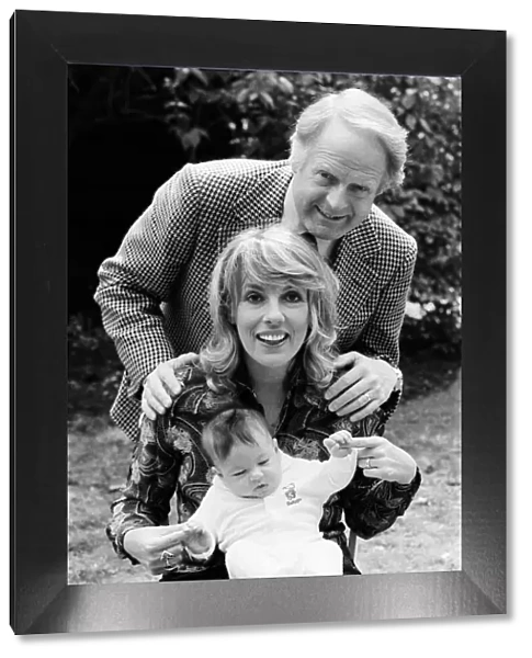 Esther Rantzen at home with her baby daughter Emily and husband Desmond Wilcox