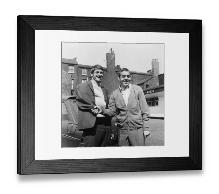 Framed Print : Liverpool footballer Roger Hunt receives an armless handshake from Ian St John as he Framed Print : Liverpool footballer Roger Hunt receives an armless handshake from Ian St John as he