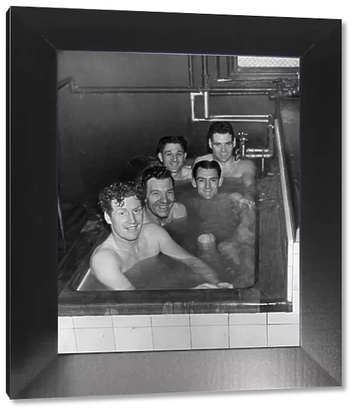 Liverpool footballers in the bath after a match, shortly before their appearance inn
