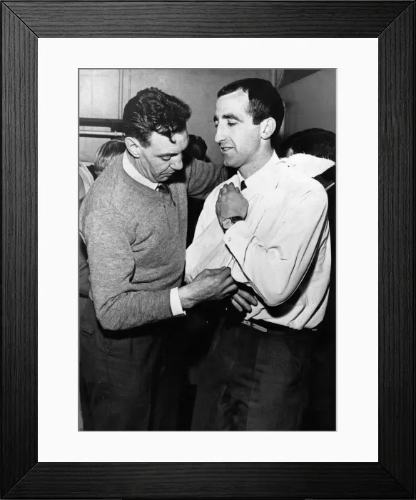 Framed Print : Liverpool assistant trainer Joe Fagan puts the injured right shoulder of Gerry Byrne in a Framed Print : Liverpool assistant trainer Joe Fagan puts the injured right shoulder of Gerry Byrne in a