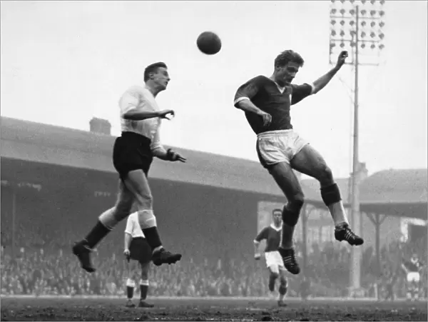 Roger Hunt beaten to the ball by Jackson of Lincoln City during the match at Anfield