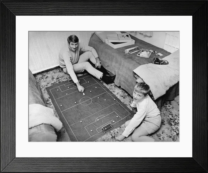 Framed Print : Liverpool forward Roger Hunt at home playing subbuteo with his son Framed Print : Liverpool forward Roger Hunt at home playing subbuteo with his son
