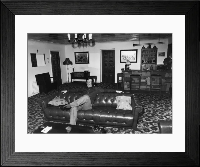 Framed Print : Liverpool footballer Tommy Smith at home on his sofa. 19th December 1973 Framed Print : Liverpool footballer Tommy Smith at home on his sofa. 19th December 1973