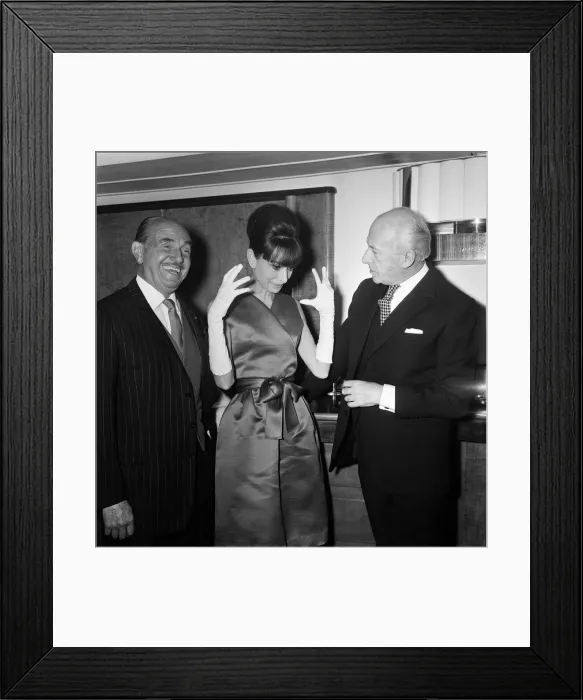 Framed Print : Actress Audrey Hepburn pictured with Jack L Warner (left Framed Print : Actress Audrey Hepburn pictured with Jack L Warner (left