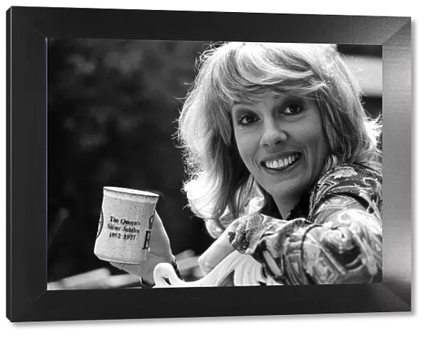 Esther Rantzen enjoys a cup of tea at home. 15th May 1978