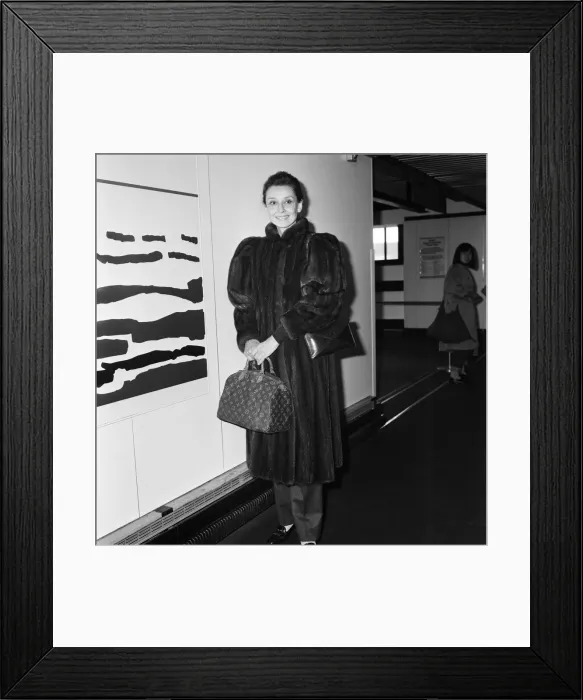 Framed Print : Actress Audrey Hepburn at an airport. April 1984