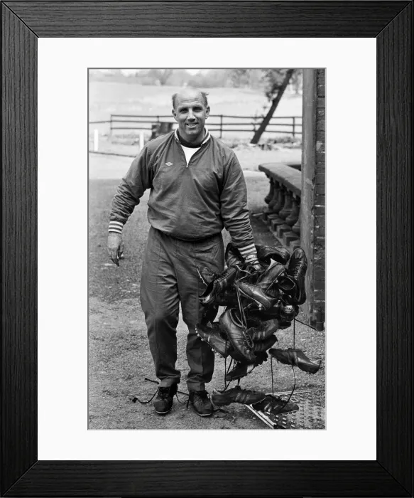 Framed Print : Liverpool trainer Ronnie Moran collecting boots after a training session at Melwood