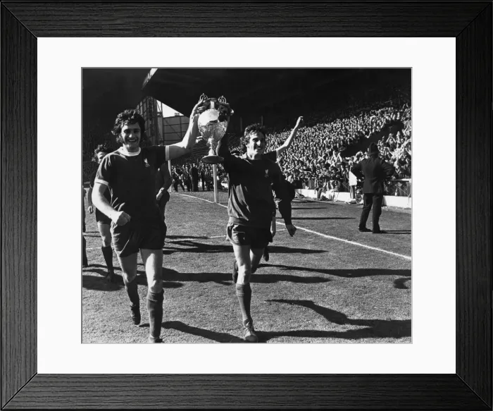 Framed Print : Ray Clemence and Larry Lloyd of Liverpool parade the League Championship trophy following Framed Print : Ray Clemence and Larry Lloyd of Liverpool parade the League Championship trophy following