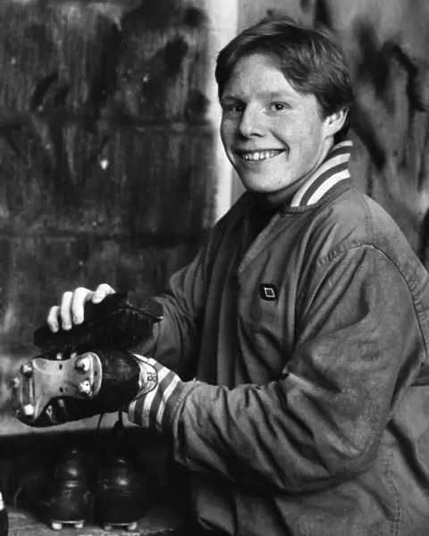 Young Liverpool footballer Sammy Lee getting his boots ready for the next match