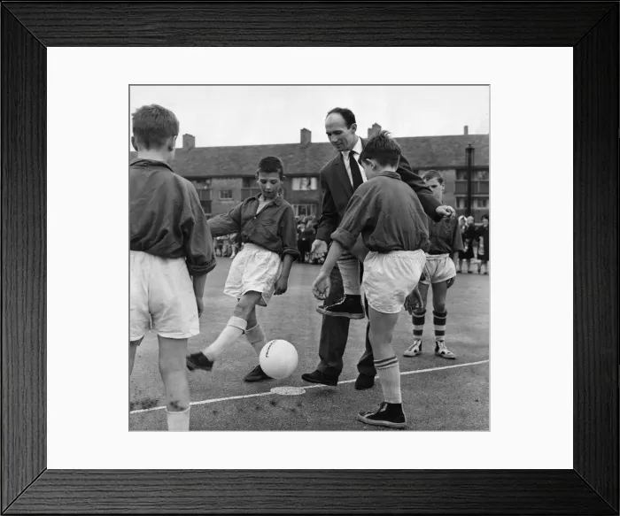 Framed Print : Liverpool footballer Jimmy Melia attends a six a side competition sponsored by