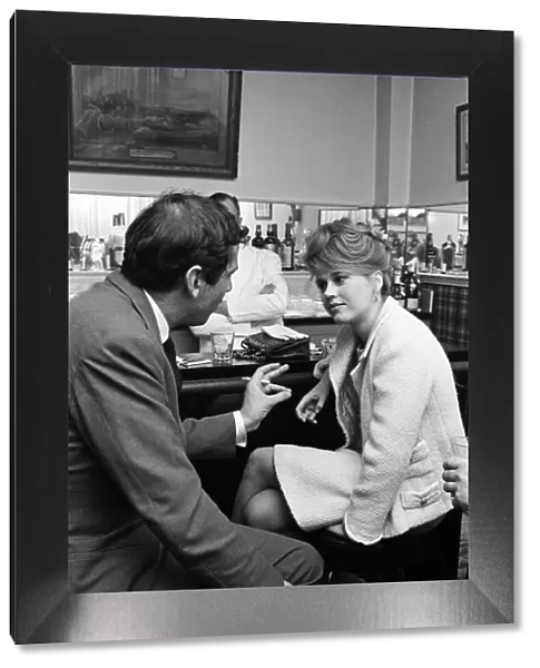 Jane Fonda and her husband, film director Roger Vadim, enjoy drinks at a bar in Paris