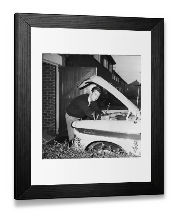 Framed Print : Liverpool footballer Gordon Milne, pictured at his home, checking the engine of his car Framed Print : Liverpool footballer Gordon Milne, pictured at his home, checking the engine of his car