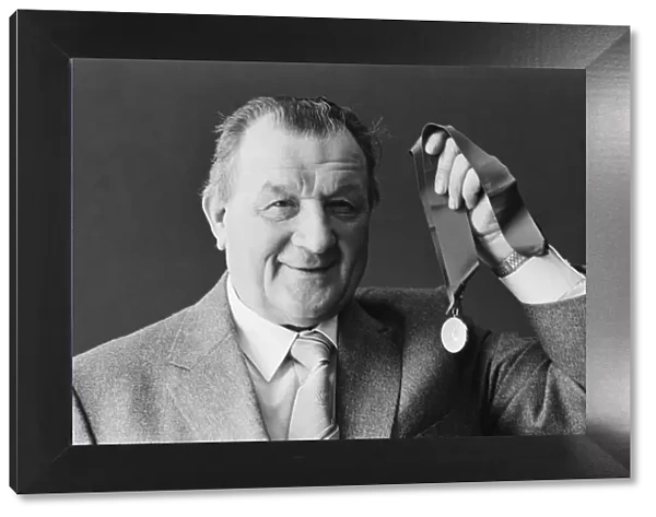 Liverpool manager Bob paisley proudly displays his latest award as '