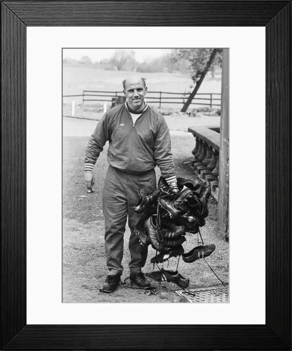 Framed Print : Liverpool trainer Ronnie Moran holding a large collection of player Framed Print : Liverpool trainer Ronnie Moran holding a large collection of player