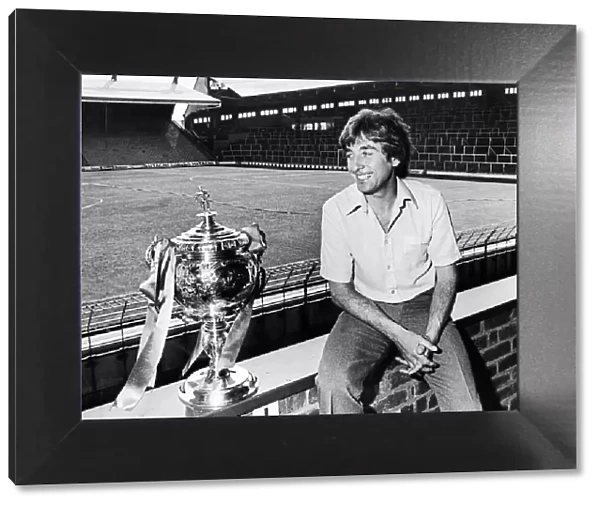 Liverpool Reserve team boss Roy Evans poses beside the Central League Championship trophy