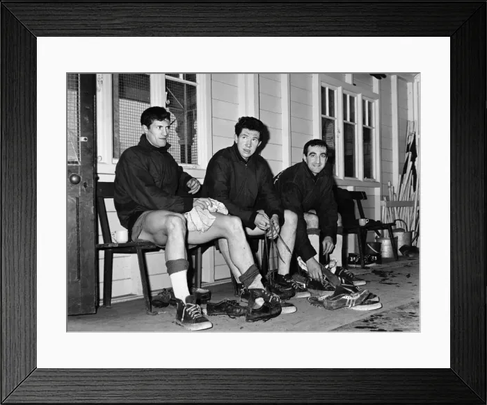 Framed Print : Liverpool footballers Willie Stevenson, Chris Lawler and Gerry Byrne take off their Framed Print : Liverpool footballers Willie Stevenson, Chris Lawler and Gerry Byrne take off their