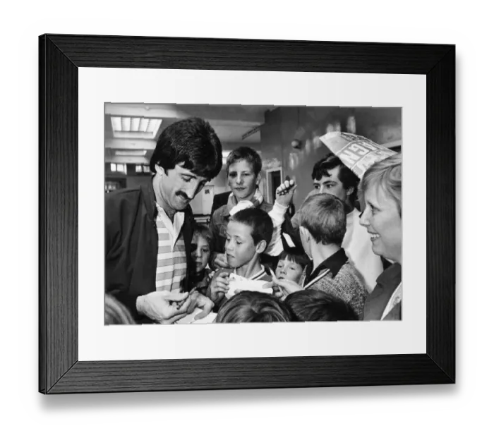 Framed Print : Liverpool footballer David Johnson signing autographs for young fans as the team arrive Framed Print : Liverpool footballer David Johnson signing autographs for young fans as the team arrive