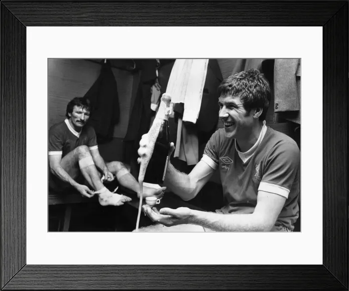 Framed Print : Emlyn Hughes celebrates the League Championship title with a bottle of champagne in Framed Print : Emlyn Hughes celebrates the League Championship title with a bottle of champagne in
