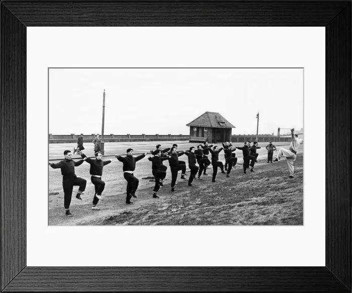 Framed Print : Liverpool football team in training at Blackpool during a session led by their manager