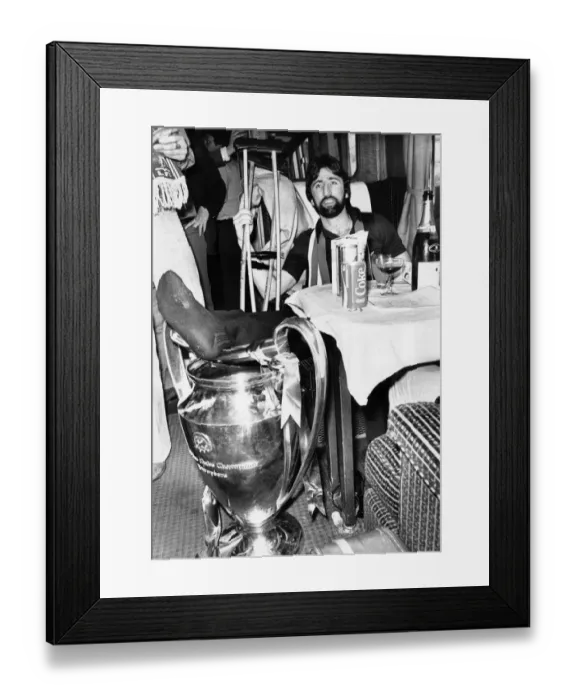 Framed Print : Injured Liverpool footballer David Johnson rests his leg on the European Cup trophy Framed Print : Injured Liverpool footballer David Johnson rests his leg on the European Cup trophy