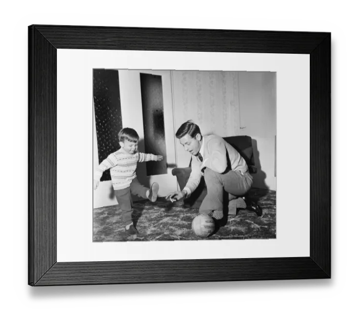 Framed Print : Liverpool football star Gordon Milne gives a coaching lesson to his young son Andrew Framed Print : Liverpool football star Gordon Milne gives a coaching lesson to his young son Andrew