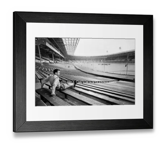 Framed Print : Injured Liverpool footballer Gordon Milne looks out over Wembley Stadium as his teammates