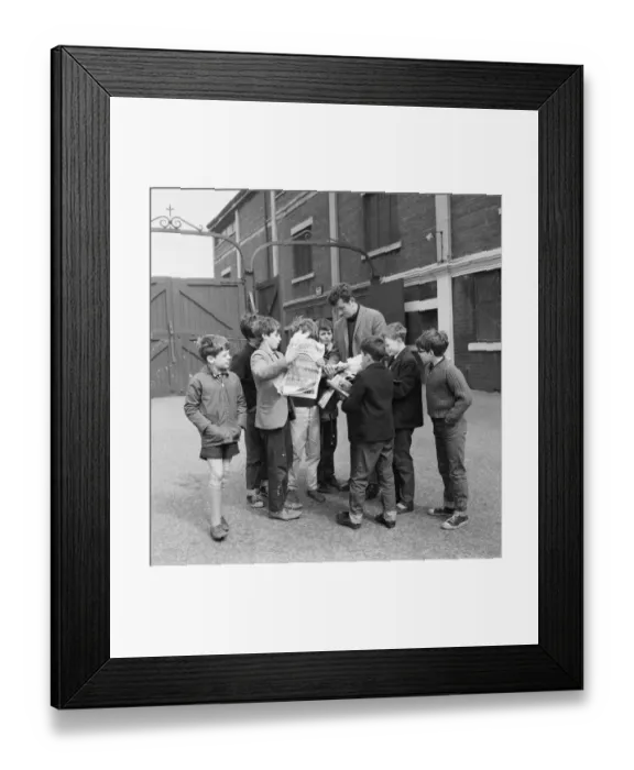 Framed Print : Liverpool goalkeeper Tommy Lawrence sign autographs for fans outside Anfield football