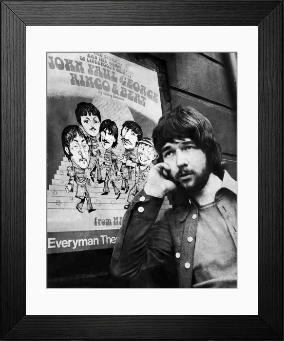 Framed Print : Liverpool playwright Willy Russell poses besides a poster for his play John, Paul, George