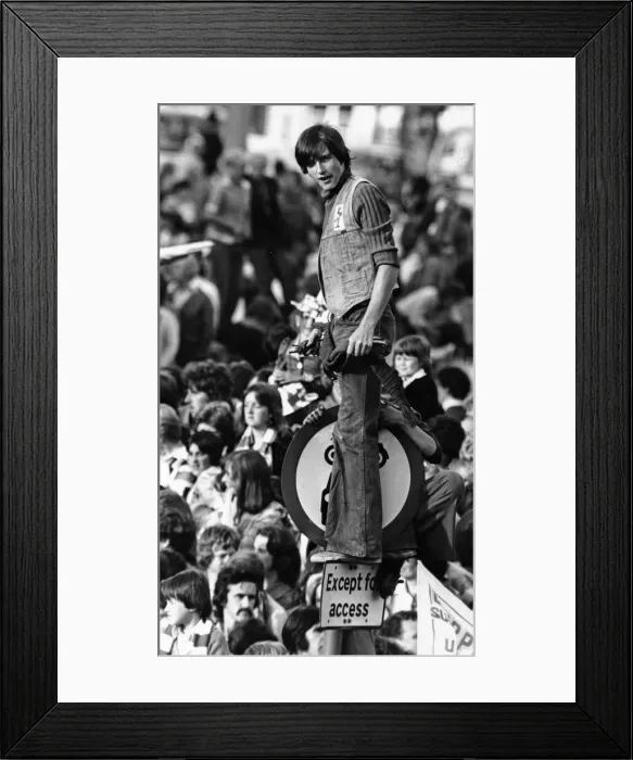 Framed Print : A Liverpool fan gets an elevated view on top of a road sign in William Brown Street as Framed Print : A Liverpool fan gets an elevated view on top of a road sign in William Brown Street as