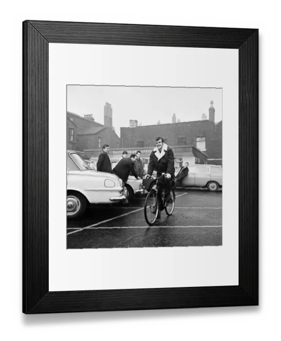 Framed Print : Liverpool footballer Alf Arrowsmith travels to Anfield on a bicycle bought for him by his