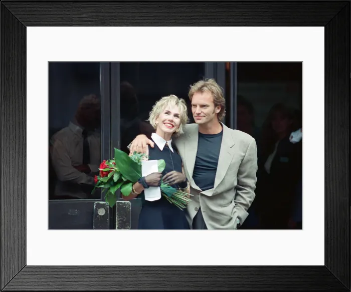 Framed Print : Sting holds and his bride Trudie Styler outside Camden register office, London Framed Print : Sting holds and his bride Trudie Styler outside Camden register office, London