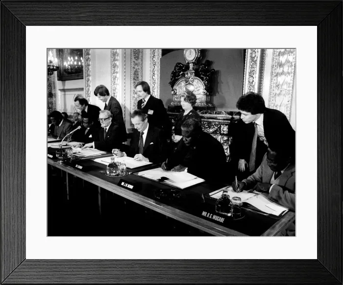Framed Print : Joshua Nkomo signing the Final Agreement on the future of Rhodesia as the independent