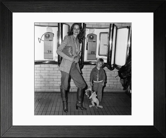 Framed Print : Charlotte Rampling at Heathrow Airport with her son Barnaby. 6th March 1976 Framed Print : Charlotte Rampling at Heathrow Airport with her son Barnaby. 6th March 1976