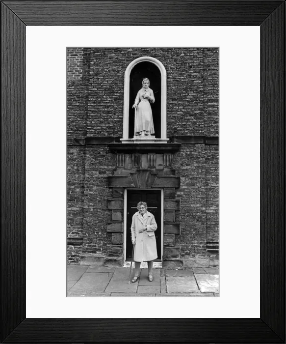 Framed Print : A lady stands outside Sir William Turners Almhouses, Kirkleatham. 14th February 1981 Framed Print : A lady stands outside Sir William Turners Almhouses, Kirkleatham. 14th February 1981