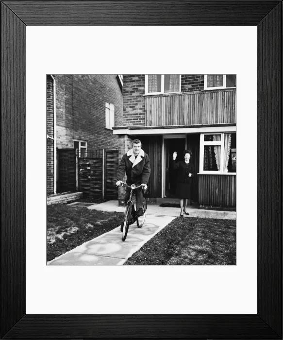 Framed Print : Liverpool footballer Alf Arrowsmith travels to Anfield on a bicycle bought for him by his Framed Print : Liverpool footballer Alf Arrowsmith travels to Anfield on a bicycle bought for him by his