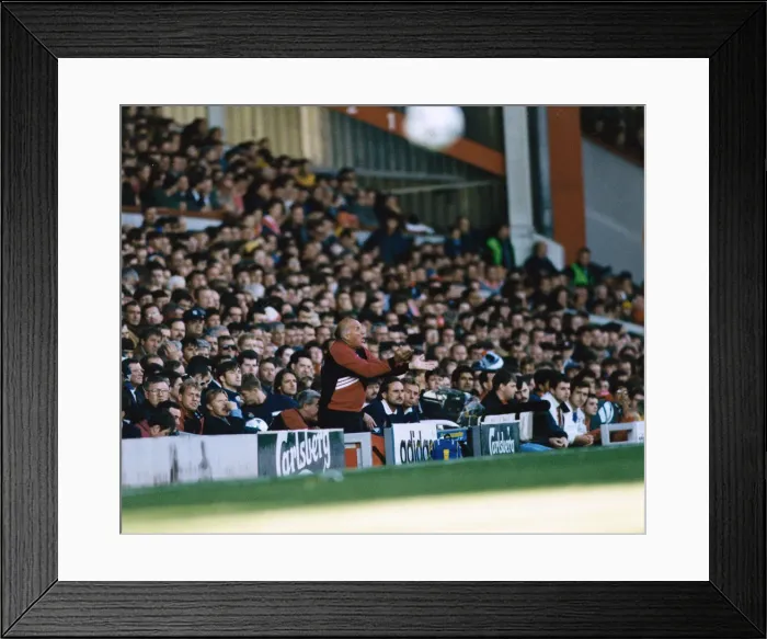 Framed Print : Liverpool coach Ronnie Moran shouting out instructions from the dugout during a Premier Framed Print : Liverpool coach Ronnie Moran shouting out instructions from the dugout during a Premier