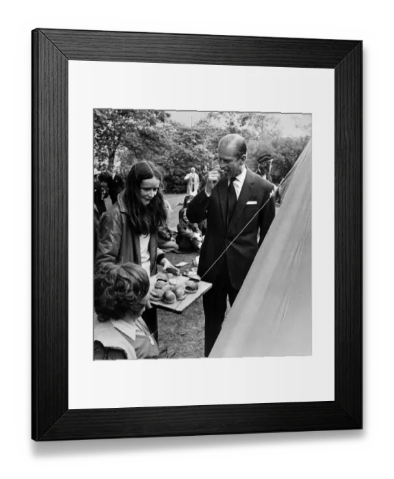 Framed Print : Prince Philip, Duke of Edinburgh, tries Guides beefburgers at Port Sunlight