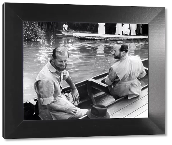 The Duke of Edinburgh Feb 1957 and Lt. Commander Michael Parker in a canoe at Gambia