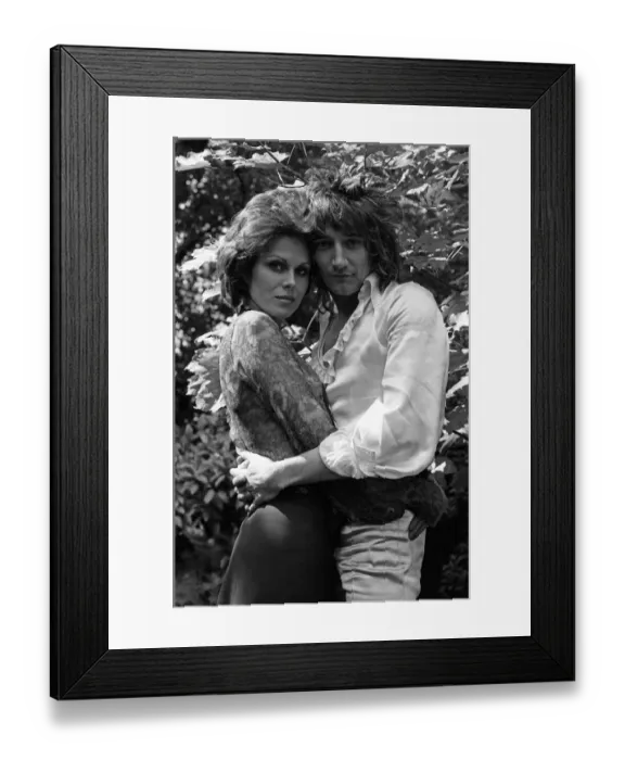 Framed Print : Pop singer Rod Stewart with his new girlfriend actress Joanna Lumley in her garden at her Framed Print : Pop singer Rod Stewart with his new girlfriend actress Joanna Lumley in her garden at her